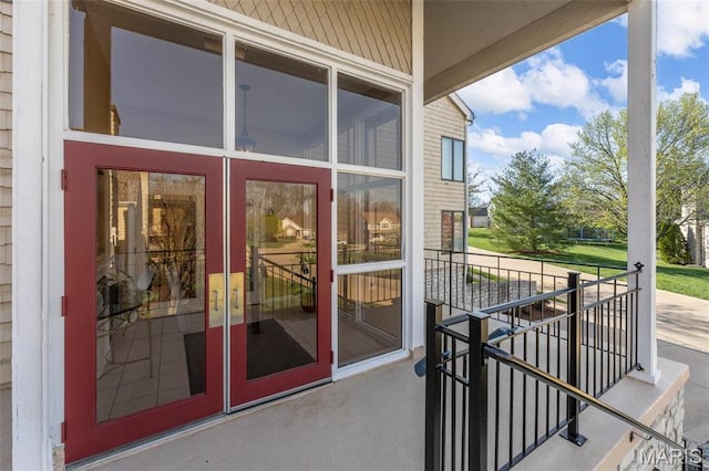 doorway to property featuring stucco siding