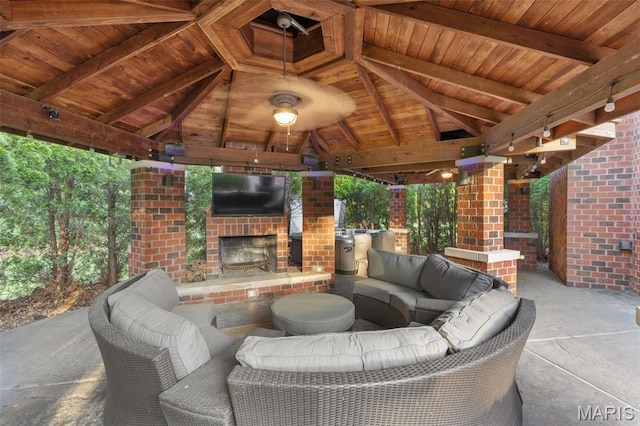 10711 Kennerly Rd, Saint Louis, MO 63128 - view of patio / terrace with a gazebo and an outdoor living space with a fireplace
