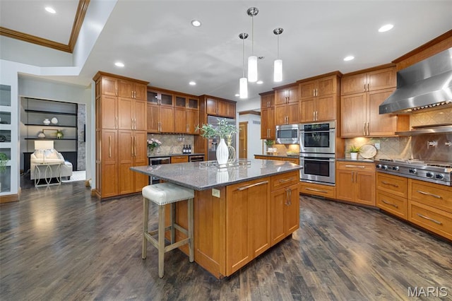 10711 Kennerly Rd, Saint Louis, MO 63128 - kitchen with appliances with stainless steel finishes, wall chimney exhaust hood, crown molding, brown cabinetry, and dark wood-style flooring