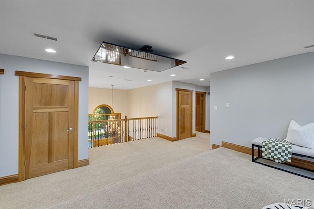 10711 Kennerly Rd, Saint Louis, MO 63128 - living area with light carpet, baseboards, recessed lighting, and an upstairs landing