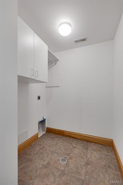 10711 Kennerly Rd, Saint Louis, MO 63128 - washroom with hookup for an electric dryer, cabinet space, and baseboards