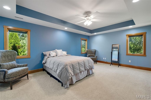 10711 Kennerly Rd, Saint Louis, MO 63128 - bedroom with carpet, baseboards, a raised ceiling, multiple windows, and recessed lighting