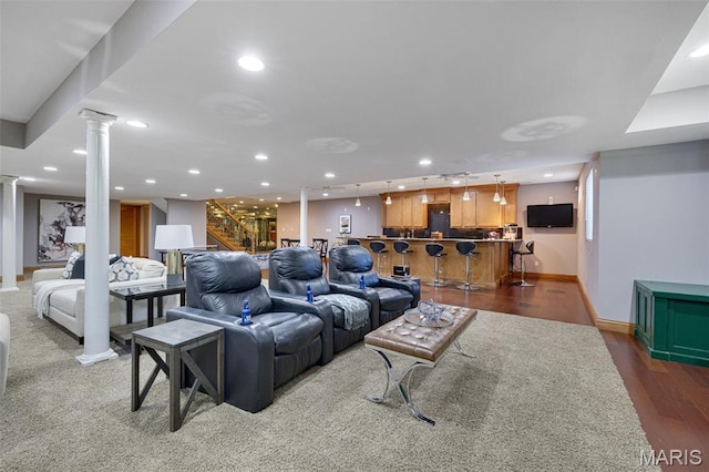 10711 Kennerly Rd, Saint Louis, MO 63128 - living room with ornate columns, bar area, recessed lighting, wood finished floors, and stairway
