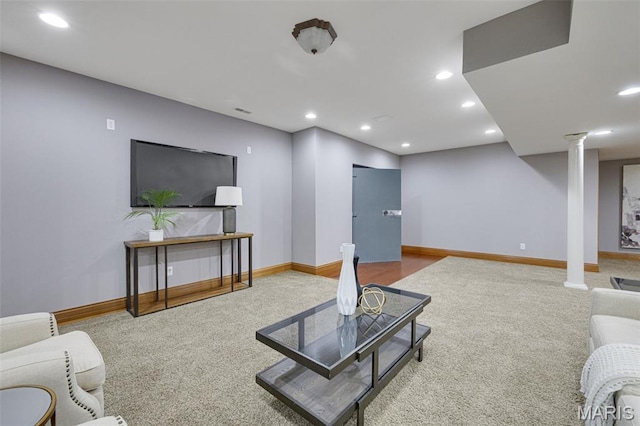 10711 Kennerly Rd, Saint Louis, MO 63128 - living area featuring decorative columns, baseboards, recessed lighting, and carpet
