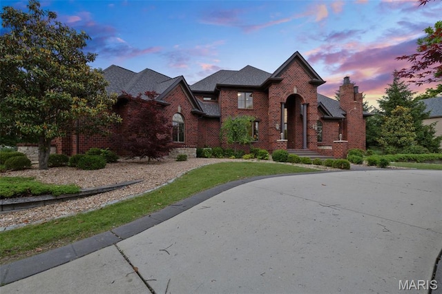 10711 Kennerly Rd, Saint Louis, MO 63128 - traditional-style home with brick siding and a yard