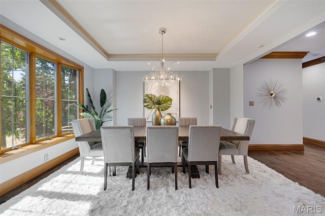 10711 Kennerly Rd, Saint Louis, MO 63128 - dining space with a chandelier, a raised ceiling, wood finished floors, baseboards, and recessed lighting