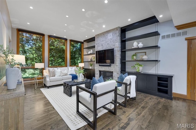 10711 Kennerly Rd, Saint Louis, MO 63128 - living area with recessed lighting, built in shelves, dark wood-style flooring, a fireplace, and floor to ceiling windows