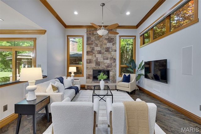 10711 Kennerly Rd, Saint Louis, MO 63128 - living room with a stone fireplace, healthy amount of natural light, baseboards, crown molding, and recessed lighting