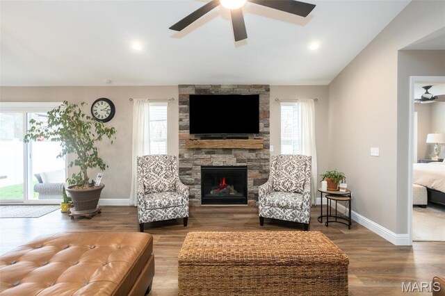 1027 Watering Stone Ct, Pevely, MO 63070 - living room with healthy amount of natural light, a fireplace, baseboards, a ceiling fan, and lofted ceiling