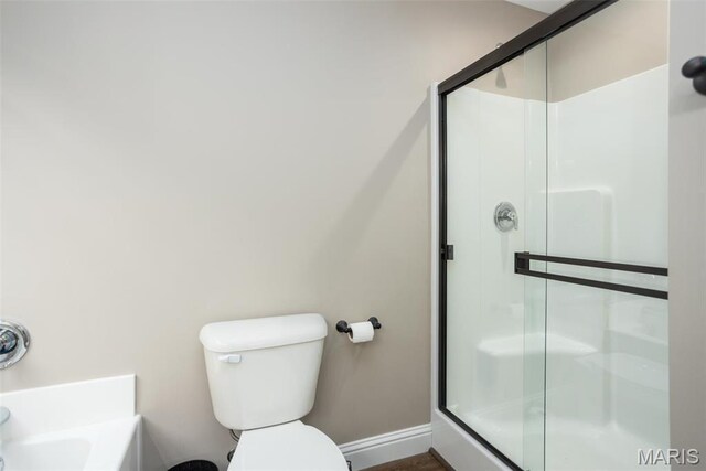 1027 Watering Stone Ct, Pevely, MO 63070 - bathroom with a shower stall, baseboards, and toilet