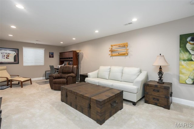 1027 Watering Stone Ct, Pevely, MO 63070 - living area featuring light colored carpet, baseboards, and recessed lighting