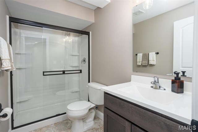 1027 Watering Stone Ct, Pevely, MO 63070 - bathroom with a shower stall, toilet, vanity, and baseboards
