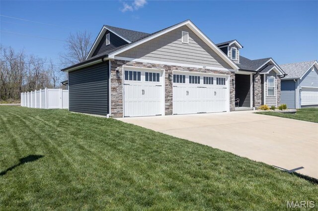 1027 Watering Stone Ct, Pevely, MO 63070 - view of front of house with an attached garage, stone siding, and driveway