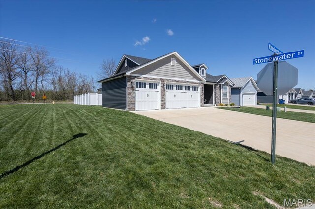 1027 Watering Stone Ct, Pevely, MO 63070 - view of front of house featuring a garage, concrete driveway, and stone siding