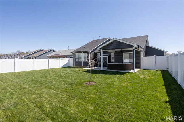 1027 Watering Stone Ct, Pevely, MO 63070 - rear view of property featuring a hot tub, a ceiling fan, and a patio area