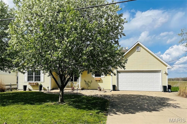 view of property hidden behind natural elements featuring concrete driveway, a front lawn, and a garage