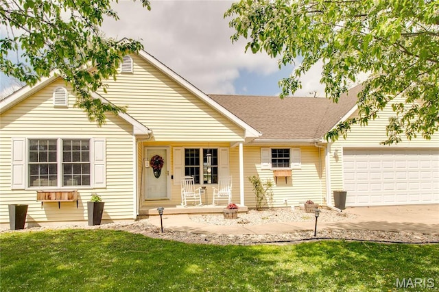 ranch-style house with a porch, an attached garage, driveway, a front yard, and roof with shingles