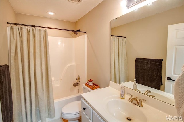 full bath with vanity, toilet, and shower / bath combination with curtain