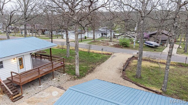 777 Squaw Rd, Cuba, MO 65453 - view of grassy yard with a residential view and a wooden deck