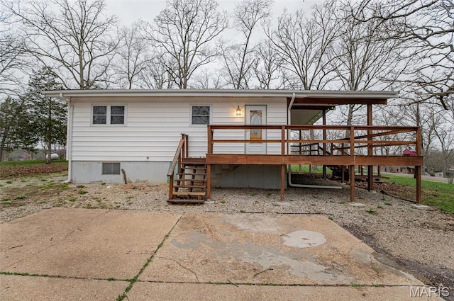 777 Squaw Rd, Cuba, MO 65453 - rear view of house featuring a wooden deck, crawl space, and stairway