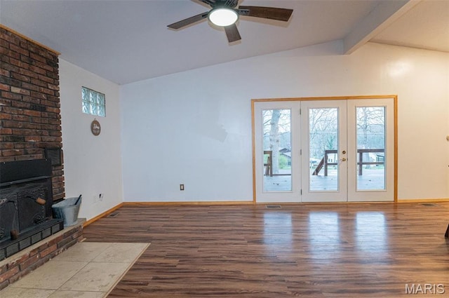 777 Squaw Rd, Cuba, MO 65453 - unfurnished living room featuring wood finished floors, a ceiling fan, baseboards, and french doors