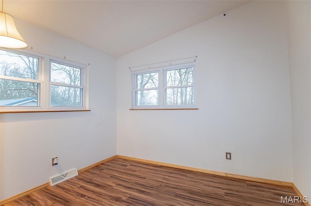 777 Squaw Rd, Cuba, MO 65453 - unfurnished room featuring wood finished floors, lofted ceiling, and baseboards