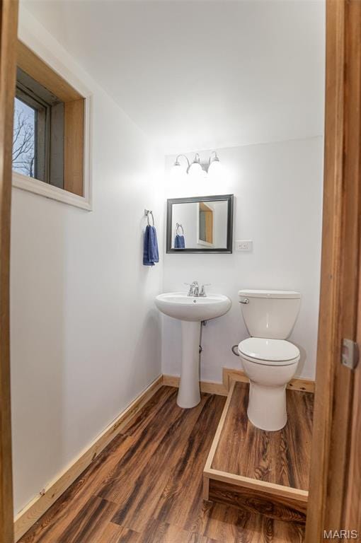 777 Squaw Rd, Cuba, MO 65453 - half bath with toilet, wood finished floors, and baseboards