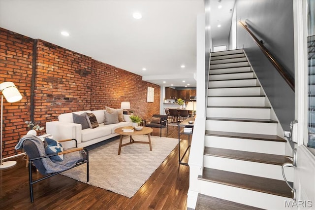 3974 Utah St, Saint Louis, MO 63116 - living area with brick wall, wood finished floors, stairs, and recessed lighting