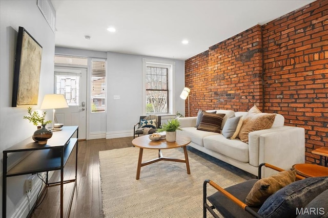 3974 Utah St, Saint Louis, MO 63116 - living area with brick wall, wood finished floors, baseboards, and recessed lighting