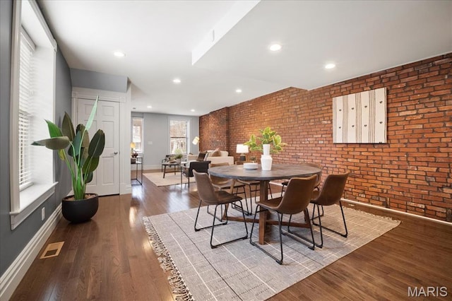 3974 Utah St, Saint Louis, MO 63116 - dining room with brick wall, baseboards, wood finished floors, and recessed lighting