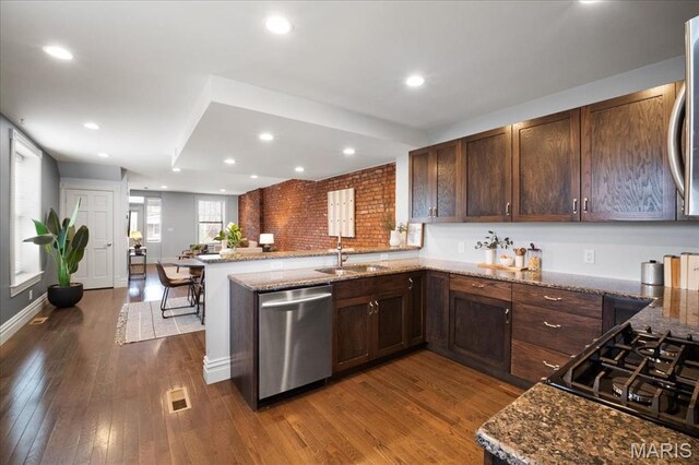3974 Utah St, Saint Louis, MO 63116 - kitchen with a sink, dishwasher, a peninsula, dark wood-type flooring, and recessed lighting