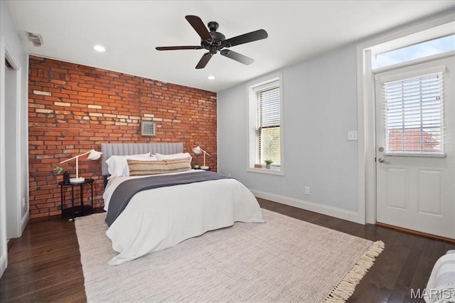 3974 Utah St, Saint Louis, MO 63116 - bedroom featuring brick wall, dark wood-style flooring, baseboards, recessed lighting, and an accent wall