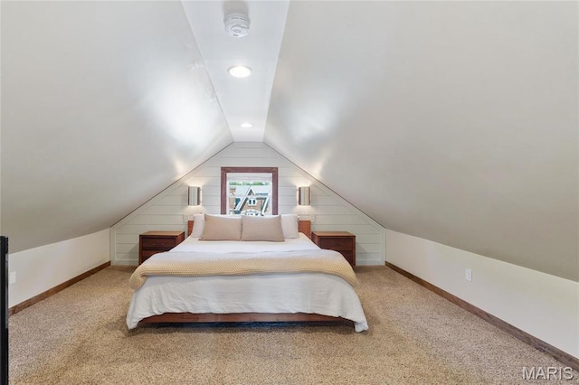 carpeted bedroom featuring lofted ceiling, baseboards, and recessed lighting