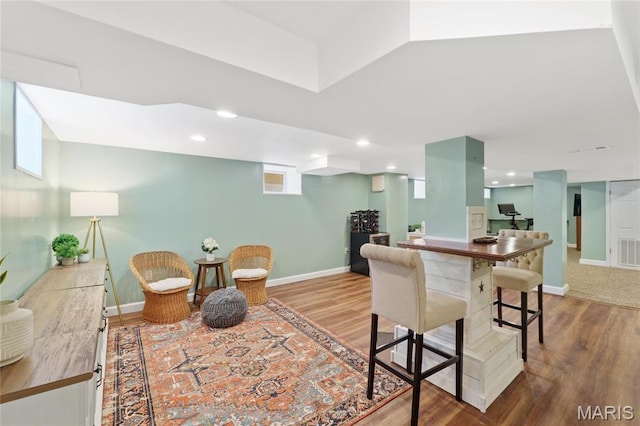 dining room featuring wood finished floors and baseboards