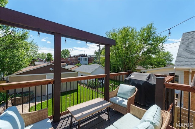 deck with a yard and outdoor lounge area