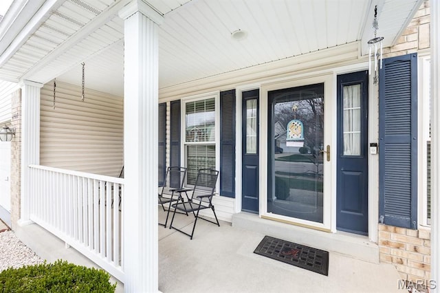 property entrance with covered porch