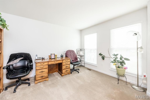 office featuring light carpet and baseboards
