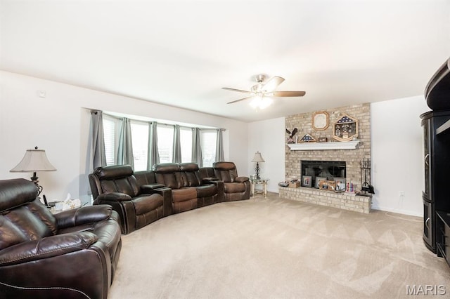carpeted living area featuring ceiling fan and a brick fireplace