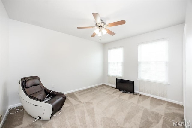 unfurnished room featuring baseboards, carpet, and a ceiling fan