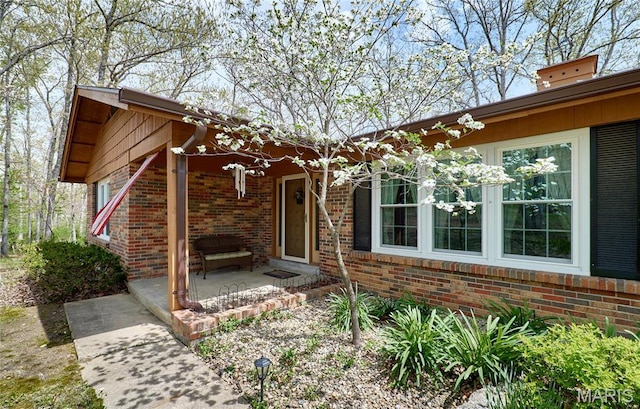 26168 Ridgetrail Dr, Warrenton, MO 63383 - entrance to property with brick siding and covered porch