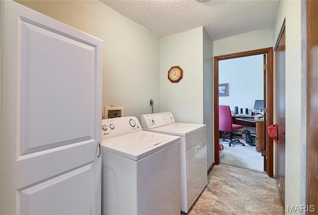 26168 Ridgetrail Dr, Warrenton, MO 63383 - washroom featuring washer and clothes dryer, a textured ceiling, and a desk