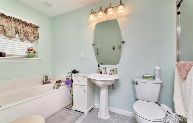 26168 Ridgetrail Dr, Warrenton, MO 63383 - full bathroom with toilet, a garden tub, tile patterned floors, and a sink