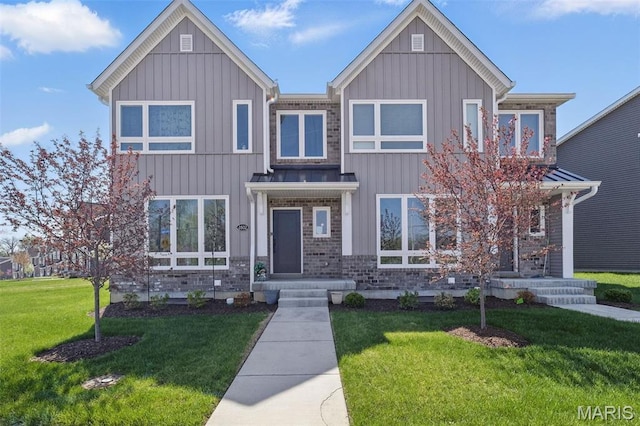 view of front of property featuring board and batten siding and a front yard