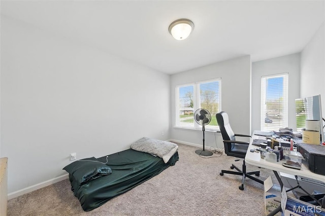 carpeted home office with baseboards