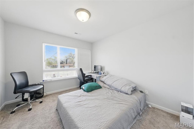 bedroom featuring carpet flooring, baseboards, and an office area