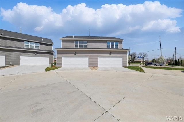 view of front of property featuring driveway and a garage