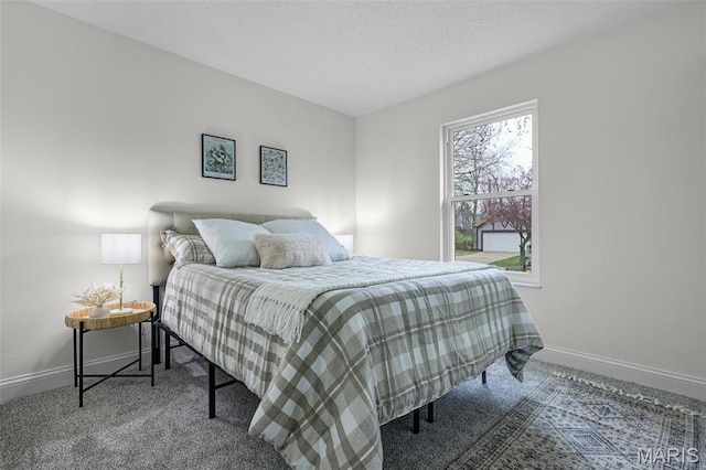 bedroom featuring carpet flooring and baseboards