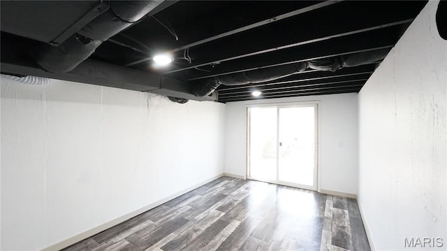 basement with wood finished floors and baseboards