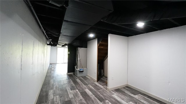 basement with wood finished floors and baseboards
