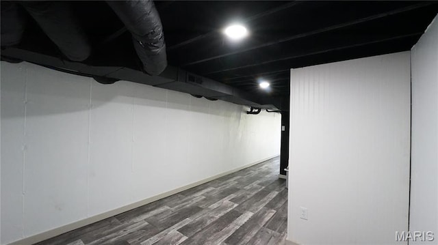 finished basement with wood finished floors and baseboards